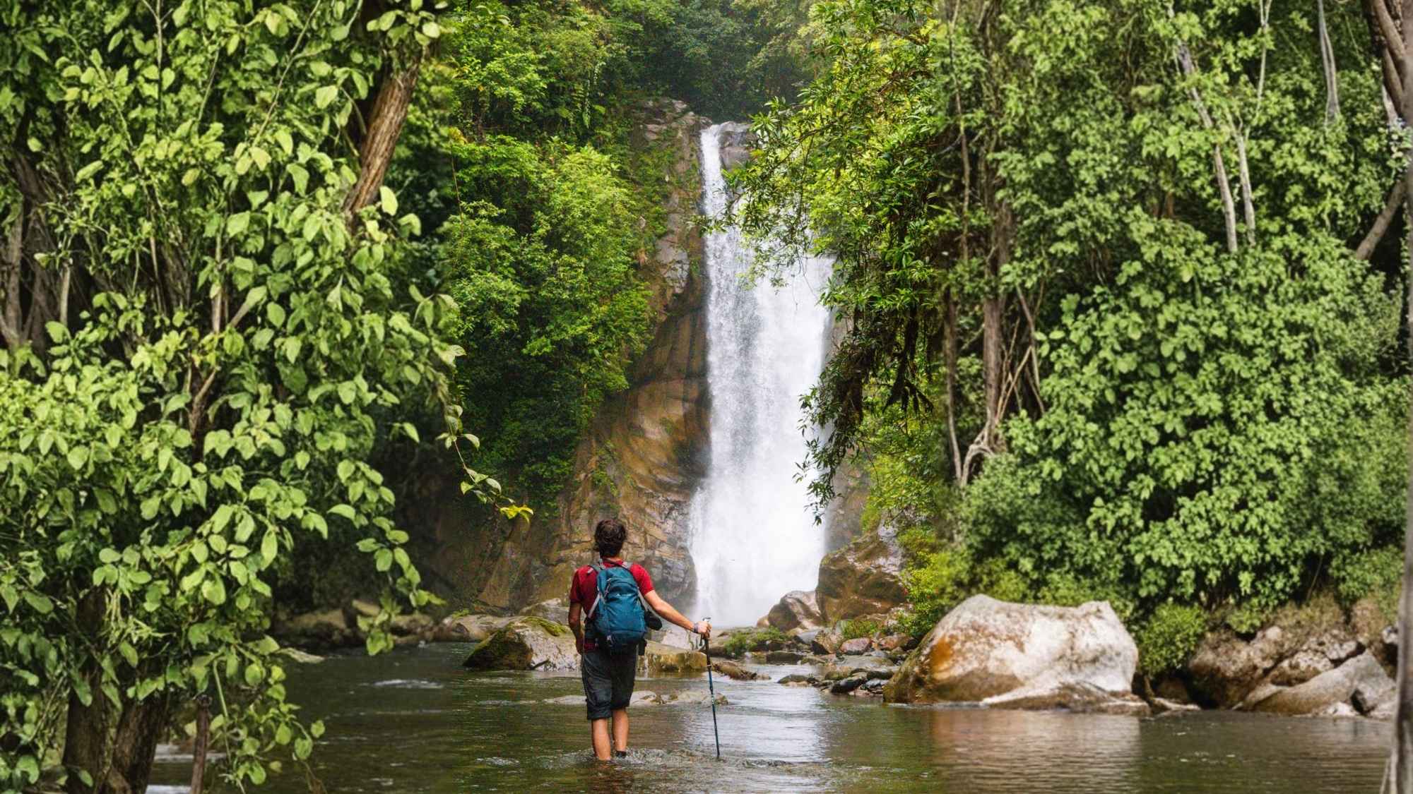 Person walking towards la Isleta waterfall in Santa Fe Veraguas